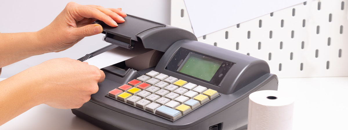 How to change a roll on a cash register?