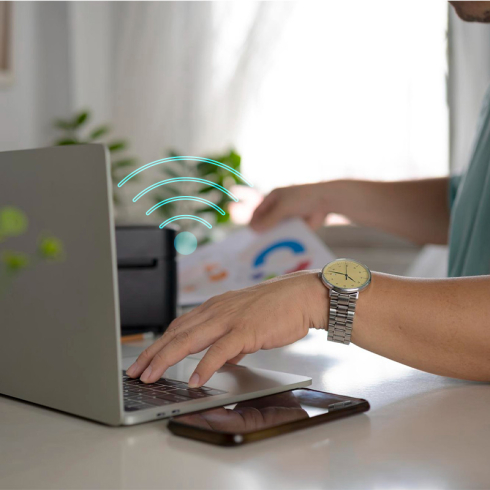 How do I connect a laptop to a printer wirelessly?